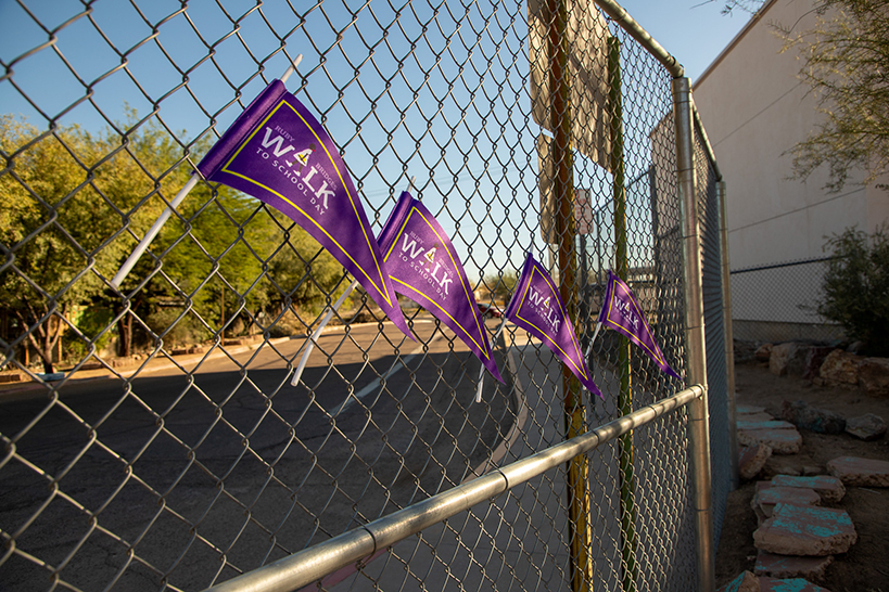 Purple Ruby Bridges pennants sticking out of the fencing