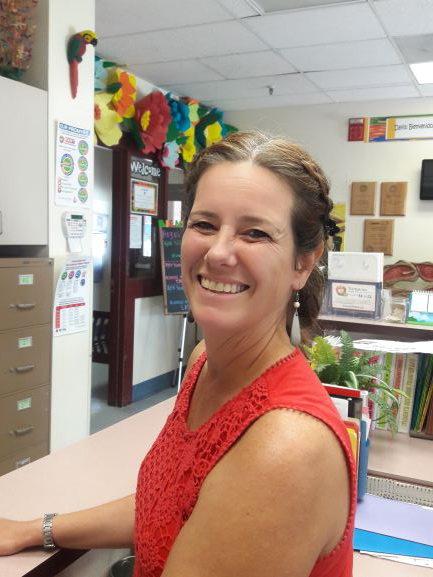 Catherine Arnquist, Magnet Coordinator smiling in her office